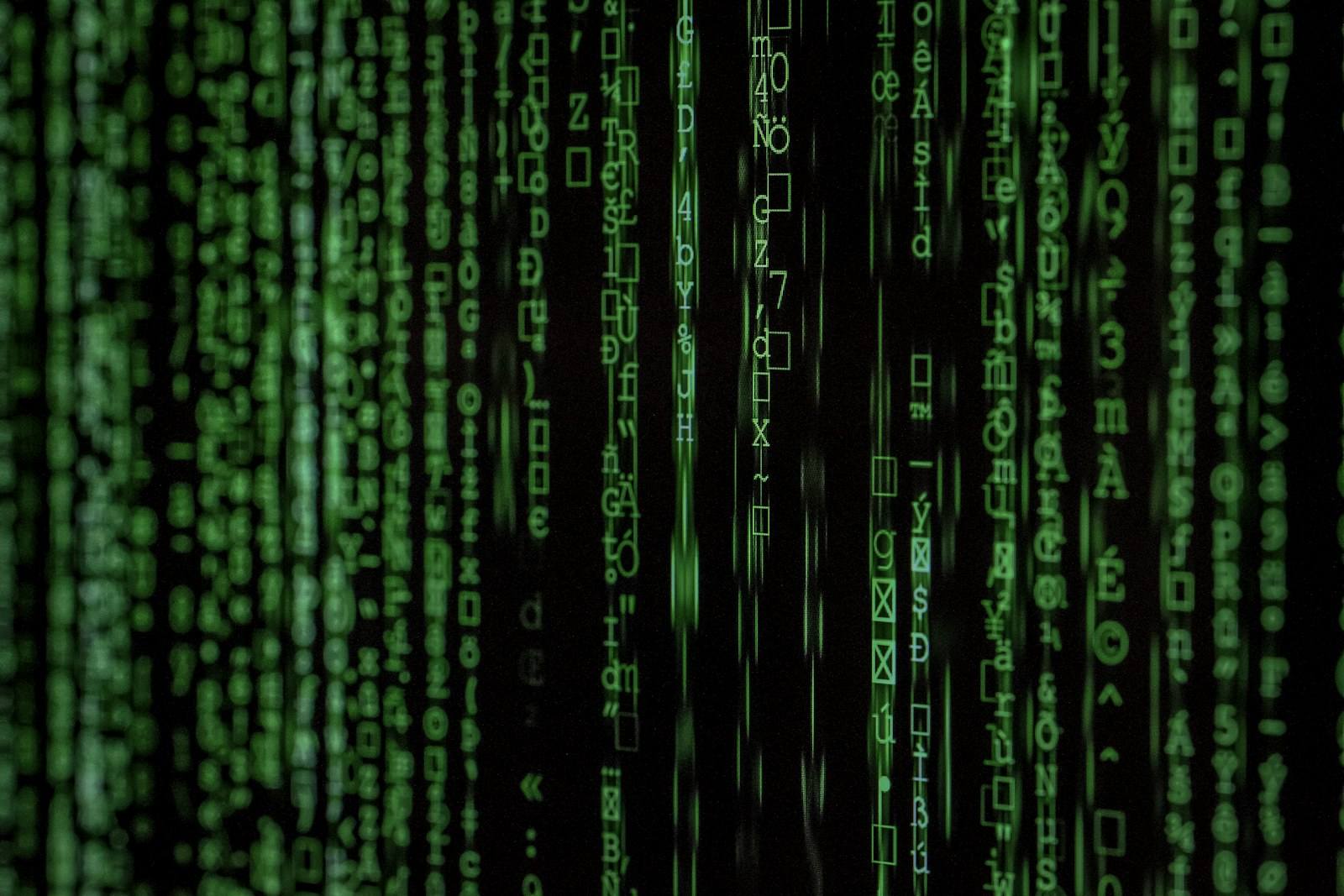 A dark field of digital code and data patterns