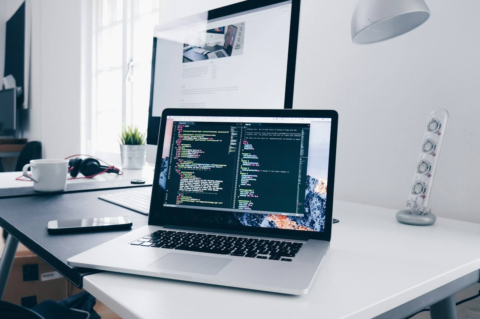Developers working with code on multiple screens, representing Web3 integration work